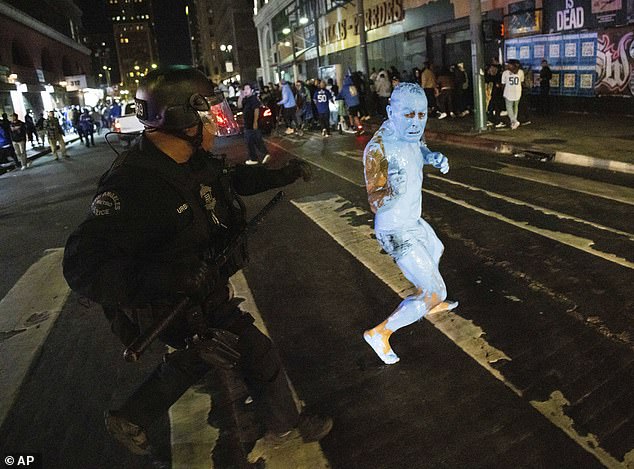 The man was photographed fleeing police in the streets after the victory.