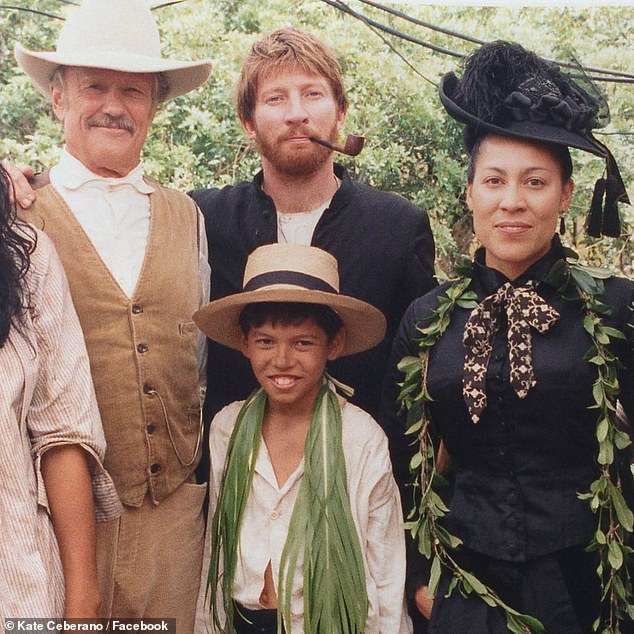 Taking to Facebook, the Brave hitmaker shared a photo showing her posing alongside Kris and co-star David Wenham on the set of the 1999 film Molokai.