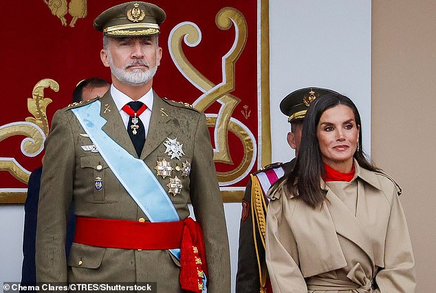 Spain's King Felipe (pictured, left) and Queen Letizia (pictured, right) were photographed attending a military parade known as Columbus Day in Madrid on Saturday.