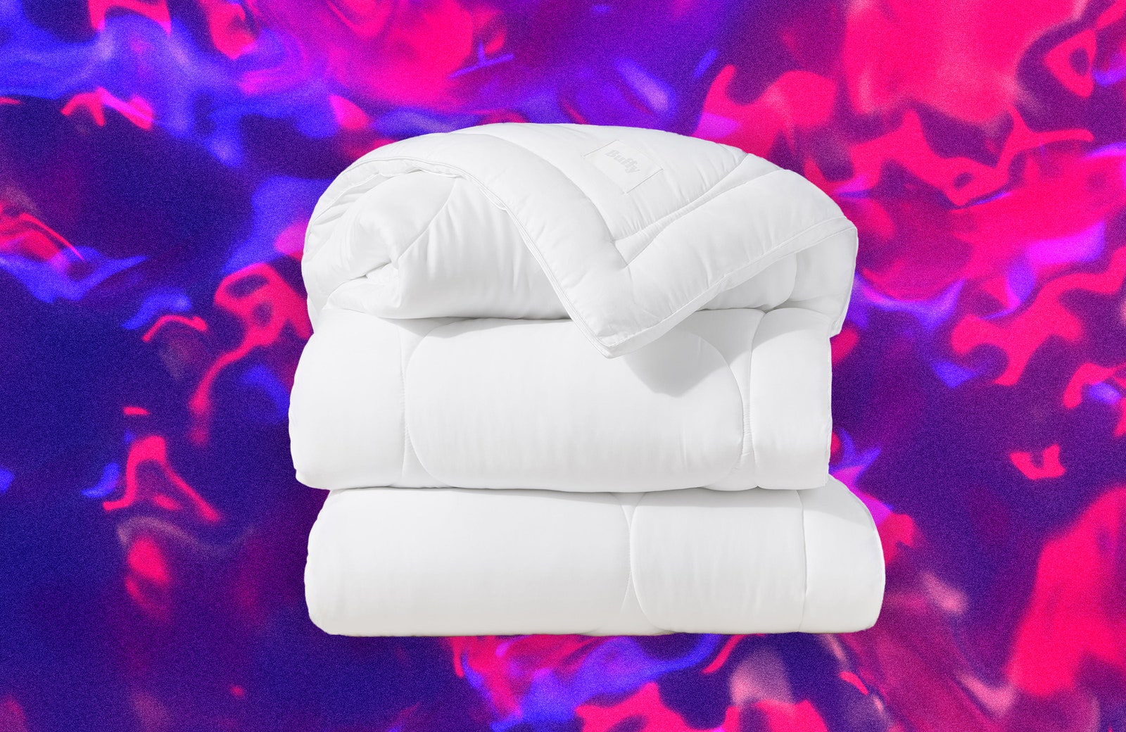 Folded fluffy white duvet. Decorative background with pink and purple swirls.