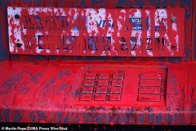 ATMs at the St Johns Wood branch were covered in red paint after activists attacked the branch on June 10.