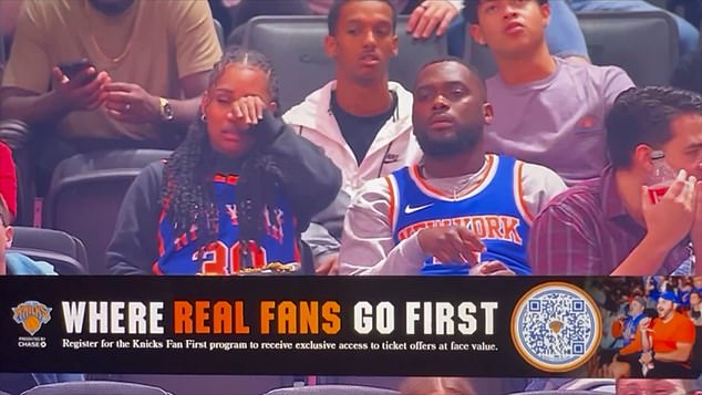 A man sitting behind the two Knicks fans listened noticeably as the woman stirred, turned her head toward an acquaintance and wiped a tear from her eye.