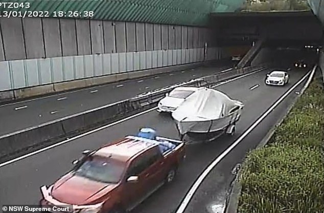 Stein is shown leaving the Lane Cove tunnel with the barrel in the back covered by a blue tarp.