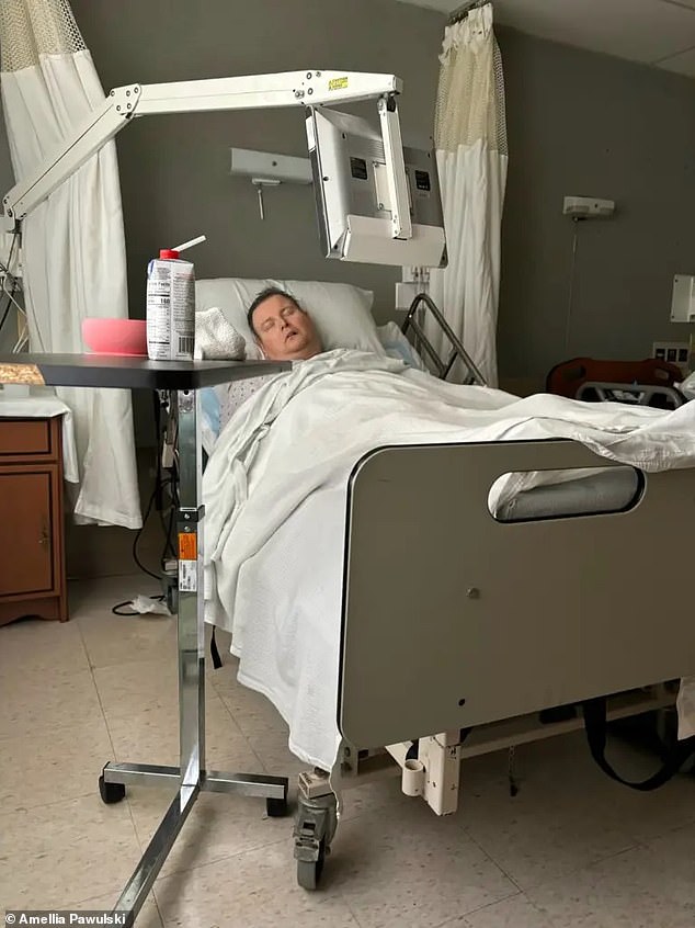 Mr. Pawuski is pictured above in the hospital. He spent five years fighting the infection that had spread to his brain.