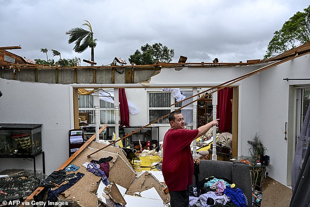 (Above) Robert Haight looks around his destroyed home after it was hit by a tornado in Fort Myers, Florida, on October 9, 2024.