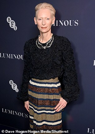 Oscar winner Tilda cut an equally elegant figure in a black ruffled top which she wore with a striking long striped skirt.