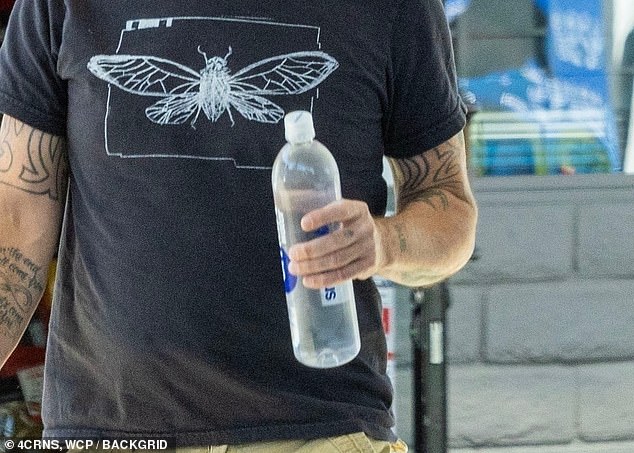 The Foo Fighters singer, who was seen for the first time since admitting to cheating on his wife Jordyn Blum on Tuesday, bought some items at a market before also stopping by a gas station.