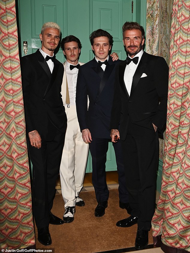 Brooklyn photographed with his father David and two younger brothers, Romeo (left) and Cruz in April 2024.