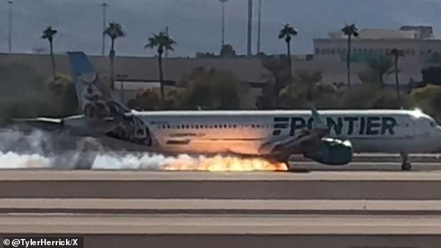 A Frontier plane caught fire as it landed at Harry Reid International Airport in Las Vegas, Nevada, on Saturday.