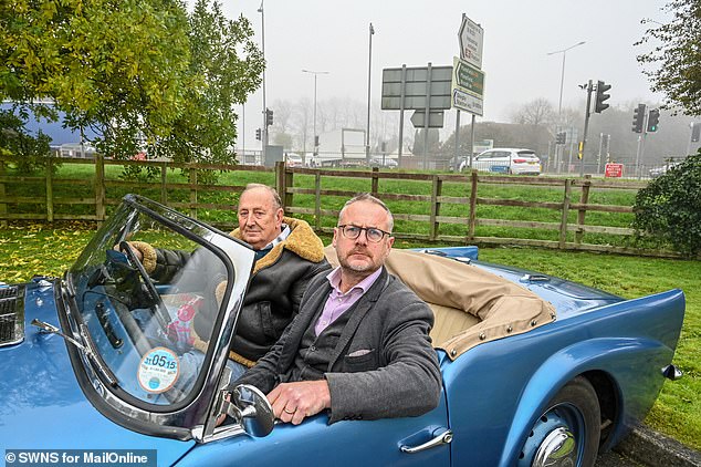 On the road: Journalist Toby Walne catches a lift with motoring activist Brian Staples in his 1961 Daimler Dart.