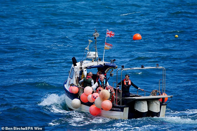 The then Prime Minister Rishi Sunak on a boat during a visit to North Devon, while on the general election campaign. Photo date: Tuesday June 18, 2024