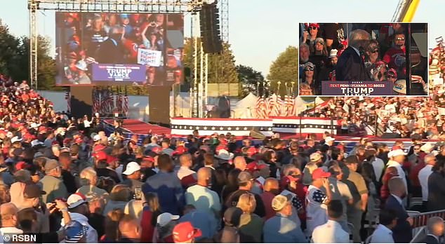 At one point, the former president had to pause the rally after a woman fainted, shouting 'we love Trump!' and sang the National Anthem for about four minutes while they treated her.