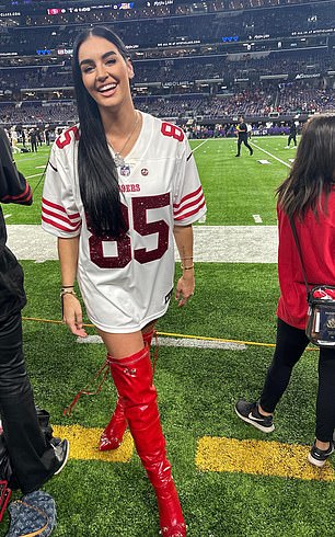 She loves to wear things that have her husband's jersey number on them.