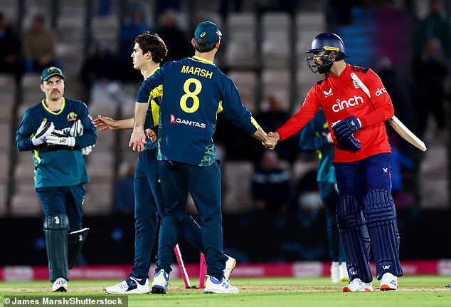 Mahmood (right) represented England against Australia in a T20 international in September.