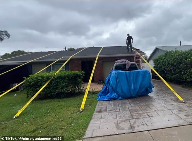 The family says the straps will remain in the house until hurricane season ends in December.