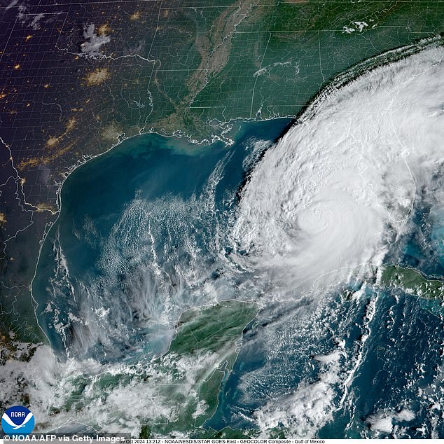 This satellite image, courtesy of the National Oceanic and Atmospheric Administration (NOAA) and the Regional and Mesoscale Meteorology Branch (RAMMB), taken on October 9, 2024, shows the formation of Hurricane Milton over the Gulf of Mexico.