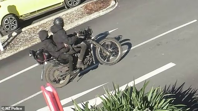 CCTV footage of the alleged armed robbery showed a man on a motorbike, but a smaller accomplice sitting on the back. They were both dressed head to toe in black clothing. Police said the second robbery suspect was a woman.