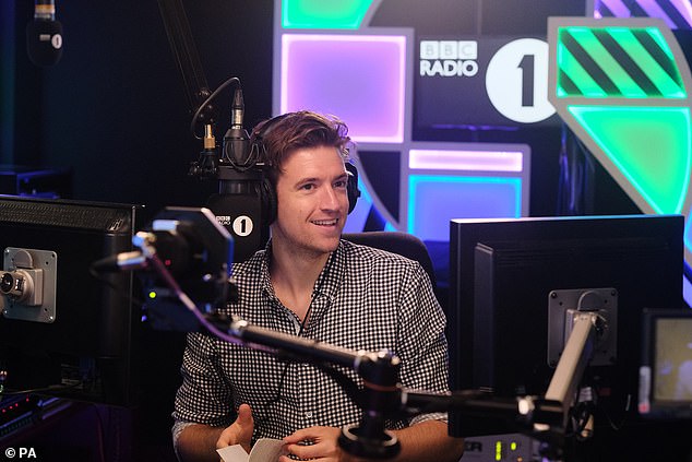 The Radio 1 Breakfast Show presenter, 38, admitted he chose his well-known surname shortly before being found by the BBC in 2007; in the photo 2018