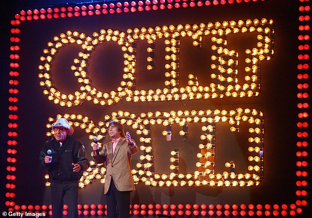 Meldrum and singer John Paul Young appear on stage at Countdown Spectacular 2 at Sydney's Rod Laver Arena in 2007.