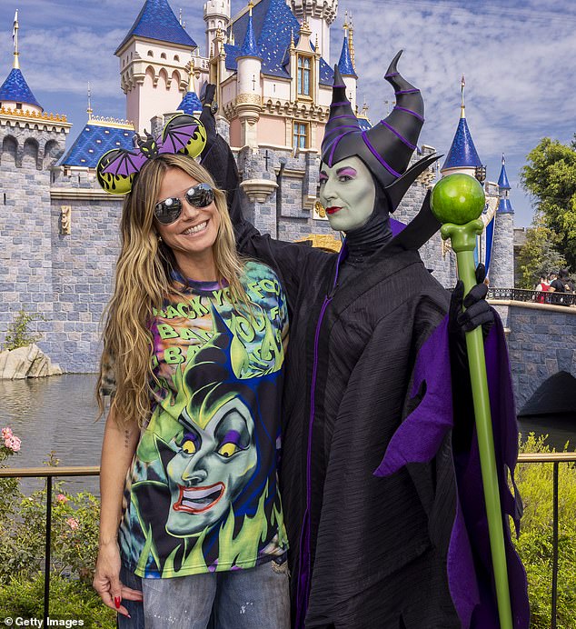 Earlier in the day, Heidi wore a spooky pair of Halloween-themed Micky Mouse ears and a cheeky graphic T-shirt while posing for photos at the Anaheim resort.