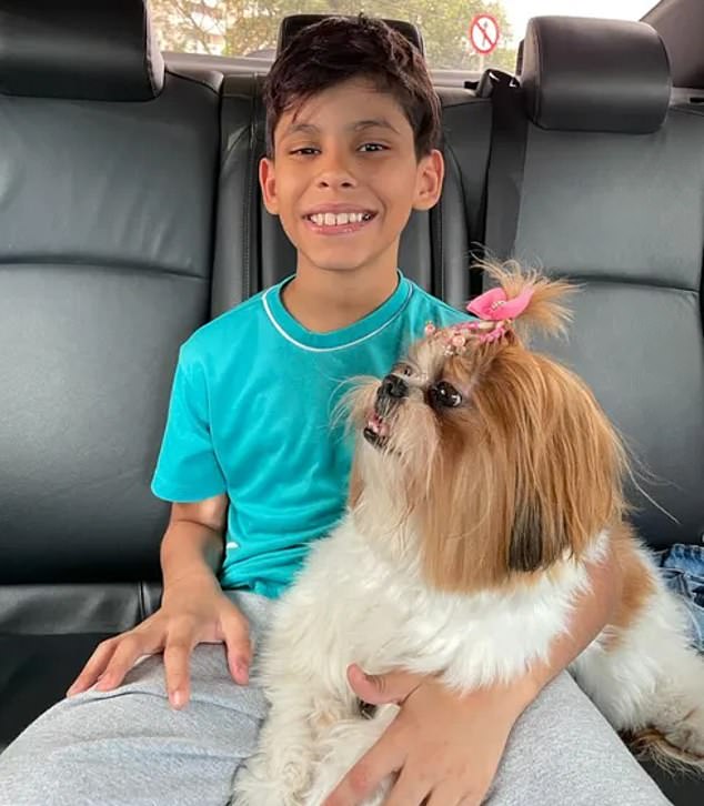 Thiago Magalhães seen here with his dog, Milú. The 11-year-old boy said that 