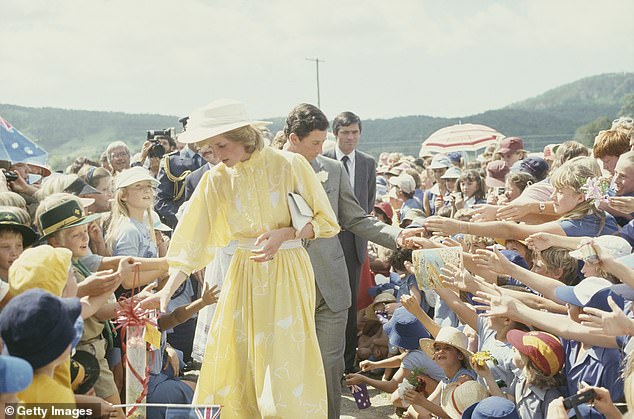 The Prince and Princess of Wales wave to the crowd during a visit to the ginger factory in Yandina, Queensland, in April 1983.