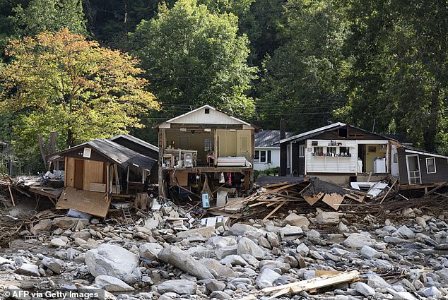 While Florida has the highest chance of experiencing heavier rainfall totals, forecasters also expect nearby states to experience flooding. Pictured: Destroyed homes in Chimney Rock, North Carolina.