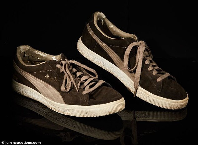 A pair of Banksy's Puma sneakers are among more than 170 lots auctioned in Los Angeles