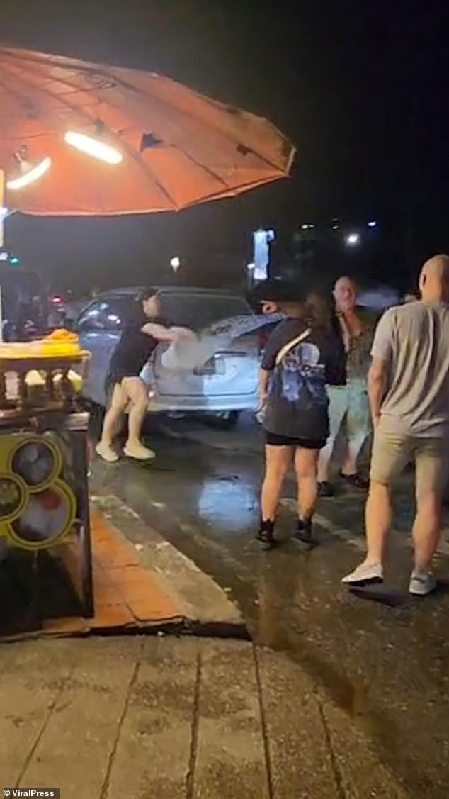 The dessert stand staff insisted it was a safety risk due to the nearby gas tank and decided to take matters into their own hands, dumping bowls of cold water on the burly man.