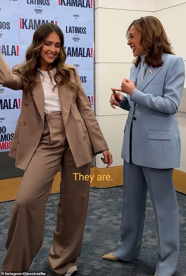 In the video, Alba, dressed in a tan pantsuit, stood next to Harris as she listened. 