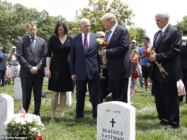 President Donald Trump speaks with Secretary of Homeland Security John Kelly and Vice President Mike Pence before laying flowers at the grave of Kelly's son, 1st Lt. Robert Kelly, at Arlington National Cemetery on May 29 2017. Lt. Kelly was killed in 2010 while leading a patrol in Afghanistan