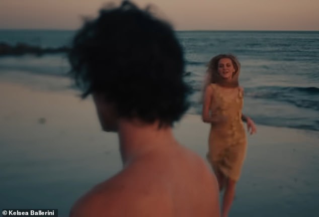 The couple was seen in several fleeting moments throughout the video. At one point, the songbird was seen running into the arms of his lover shirtless on the beach.