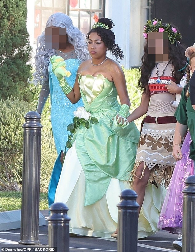 North wore white lace gloves and metallic eyeshadow to complete her look as she stepped out with her friends dressed as Elsa and Moana from Frozen.