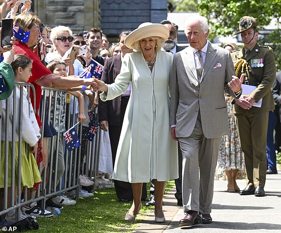 Britain's King Charles and Queen Camilla greet supporters as they leave St Thomas' Anglican Church in Sydney, Sunday, Oct. 20, 2024. (Dean Lewins/Pool Photo via AP)