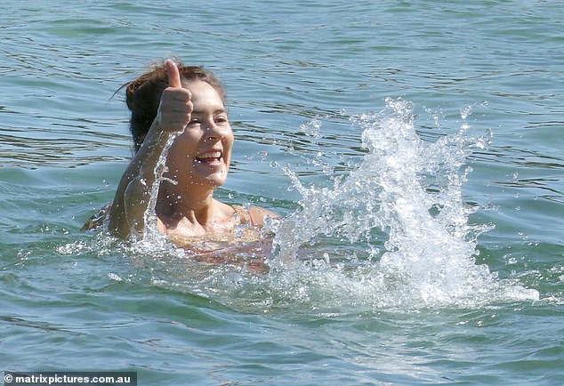 The royal looked calm as she enjoyed a dip in the cool sea.