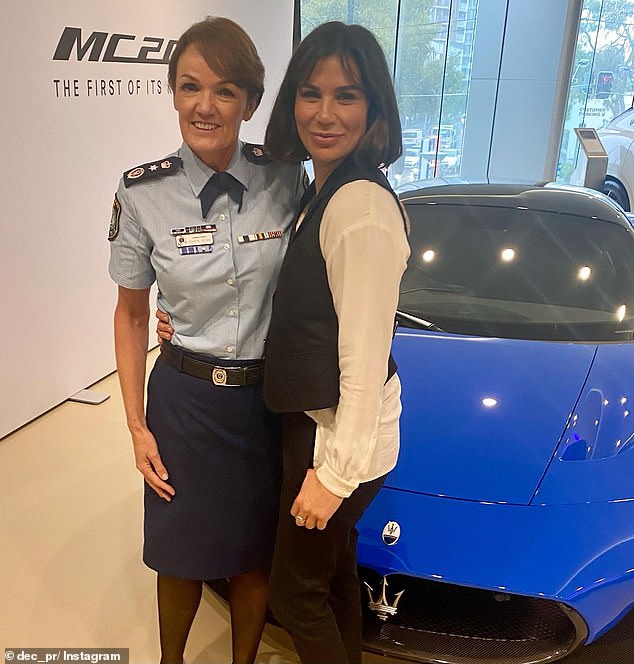 New South Wales Police Commissioner Karen Webb is pictured, left, at her husband's Maserati dealership.