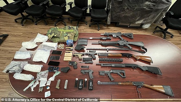 Pictured: Authorities say they confiscated guns and drugs from the Peckerwoods gang.