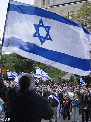 The Israeli flag is blue and white with two lines and the Star of David in the center.