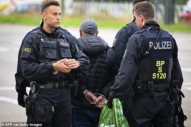 Police detain a man at the German-French border in Kehl, western Germany.