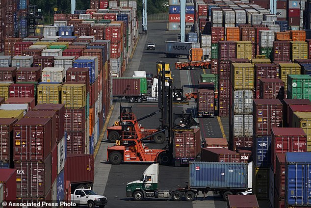 FILE - Containers move at the Port of New York and New Jersey in Elizabeth, New Jersey, June 30, 2021. (AP Photo/Seth Wenig, File)