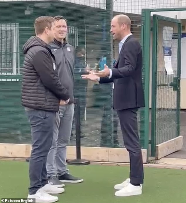 Prince William was seen wearing a pair of very shiny sneakers with his suit while visiting the NFL Foundation in London on Tuesday.