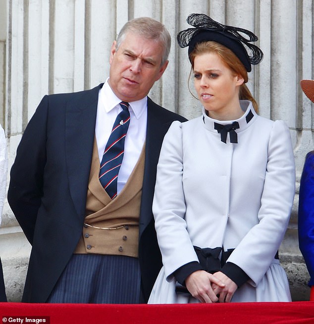 Princess Eugenie of York and Prince Andrew, Duke of York, stand on the balcony of Buckingham Palace during the annual Trooping the Color ceremony in 2013.