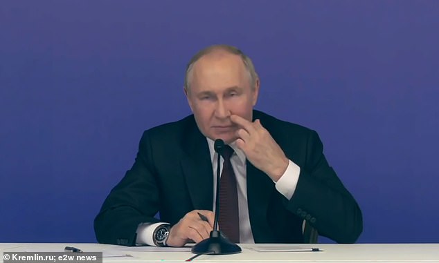 Vladimir Putin was caught on camera repeatedly poking his face during a visit to the new fencing center in Ufa.