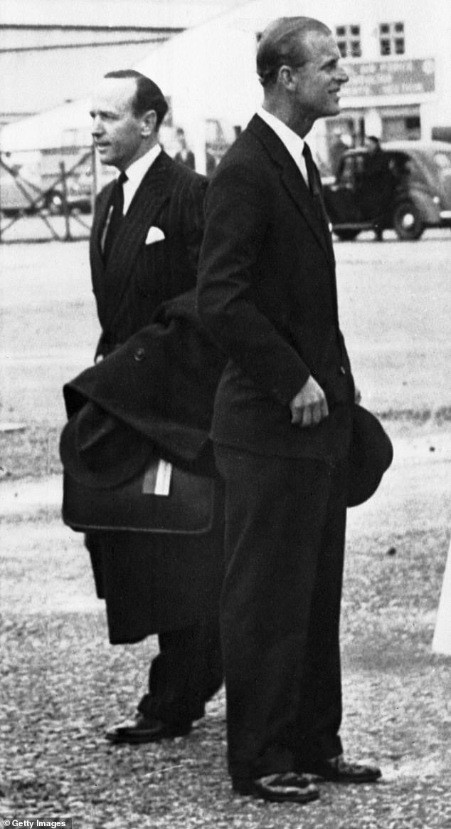 Prince Philip, right, with his private secretary, Lieutenant Commander Michael Parker, in Gibraltar in 1957.