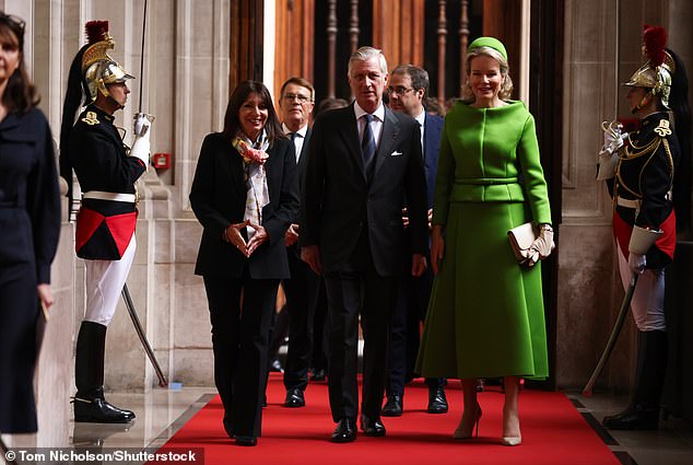 The Belgian royal accessorized the look with an elegant headband in the same shade as her suit, tucking her golden locks behind her ears.