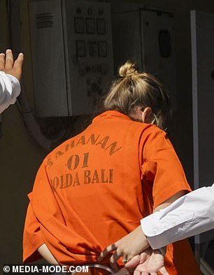 Lynley Le Grand was wearing an orange prison T-shirt, emblazoned with the word 