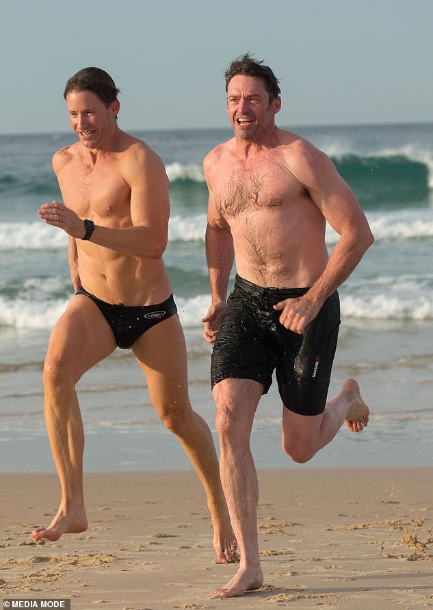 Jackman, who is a strong supporter of LGBTQ rights, has poked fun at the rumors over the years (pictured with his personal trainer in 2017).