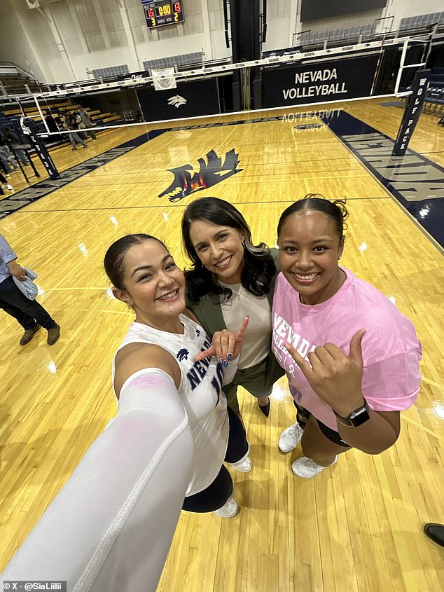 Gabbard (center) was photographed with members of the team in images shared by Sia Liilii.