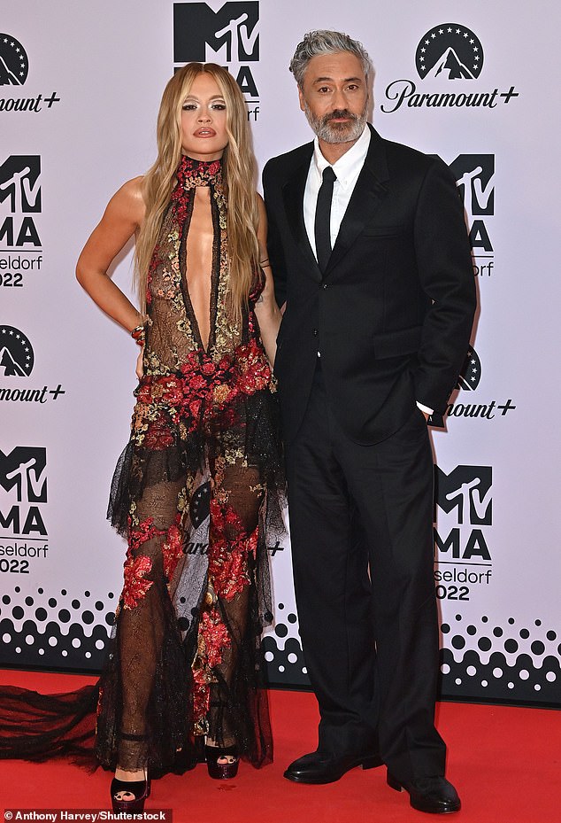 A source revealed: 'Talks between MTV and Rita's new management are ongoing and they are just ironing out the finer details' (pictured with husband Taika Waititi at the 2022 MTV EMAs in Germany)