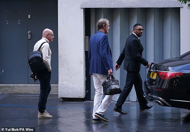 Sir Jim Ratcliffe, centre, was seen leaving the Ineos headquarters in Knightsbridge on Tuesday.